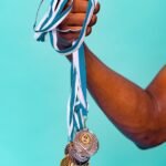 a person holding medals
